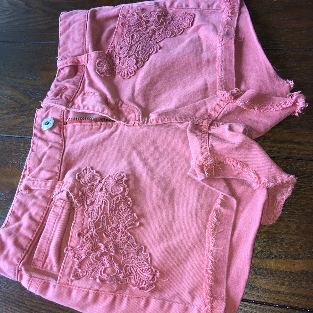Coral shorts.